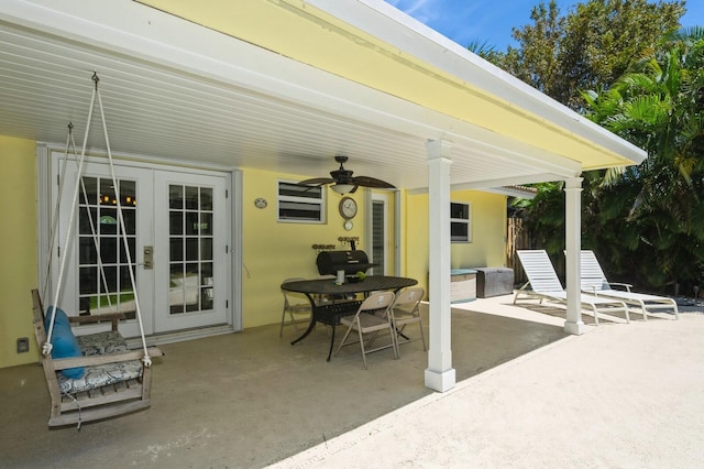 view of patio / terrace featuring a ceiling fan and french doors