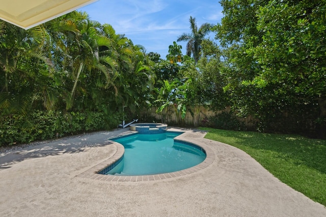 view of pool with a yard, a patio, a pool with connected hot tub, and fence private yard