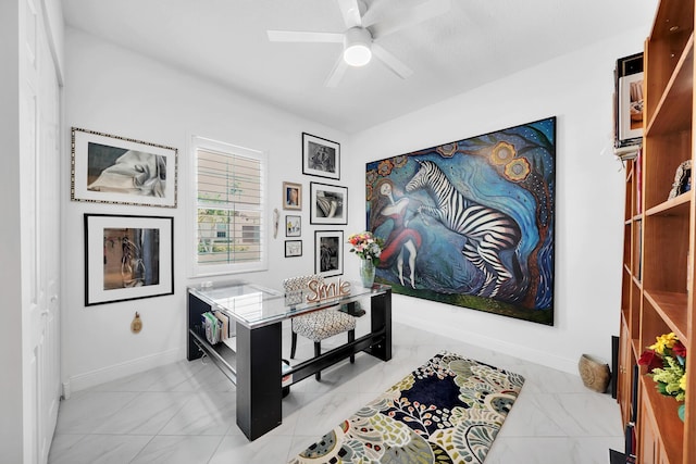 7816 Butera, Delray Beach, FL 33446 - home office featuring light marble finish floors, ceiling fan, and baseboards
