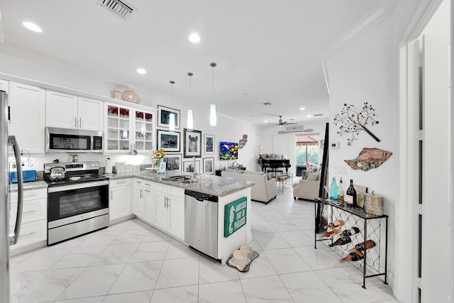 7816 Butera, Delray Beach, FL 33446 - kitchen featuring appliances with stainless steel finishes, open floor plan, a sink, a peninsula, and recessed lighting