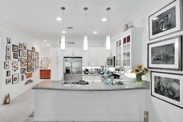 7816 Butera, Delray Beach, FL 33446 - kitchen with stainless steel appliances, ornamental molding, light stone counters, glass insert cabinets, and white cabinets