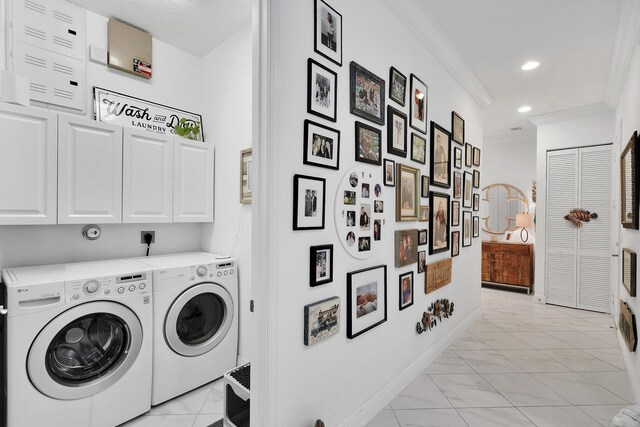 7816 Butera, Delray Beach, FL 33446 - laundry room with light marble finish flooring, washing machine and clothes dryer, ornamental molding, cabinet space, and baseboards