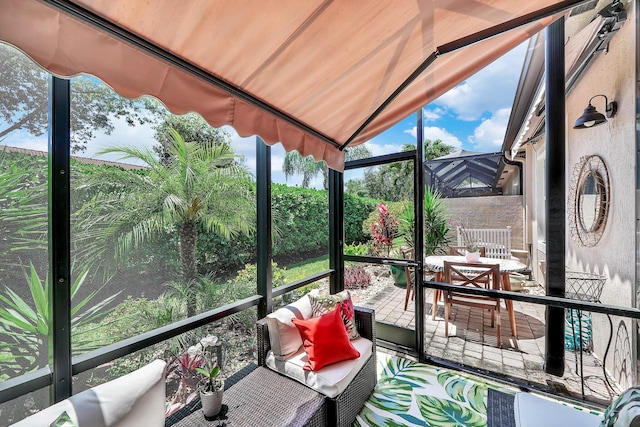 7816 Butera, Delray Beach, FL 33446 - sunroom / solarium with outdoor dining space, lofted ceiling, and an outdoor hangout area