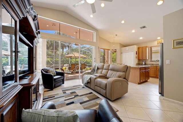 living area with recessed lighting, light tile patterned flooring, high vaulted ceiling, a ceiling fan, and visible vents