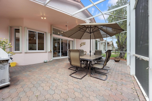 view of patio featuring a lanai and outdoor dining area
