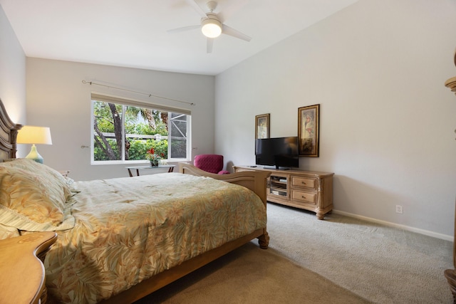 bedroom with lofted ceiling, a ceiling fan, light colored carpet, and baseboards