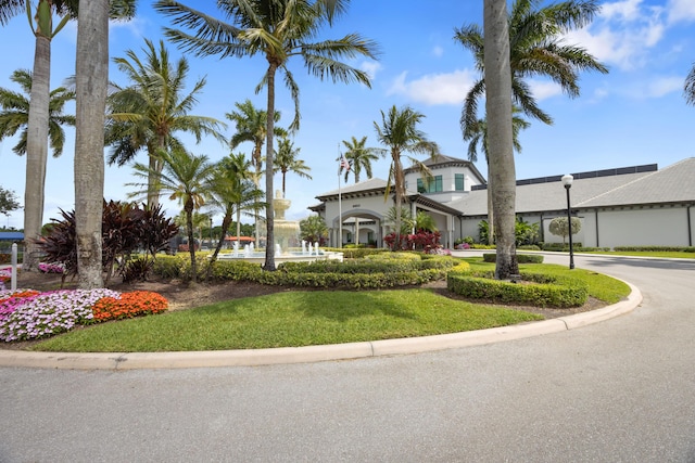 mediterranean / spanish-style home featuring a front lawn
