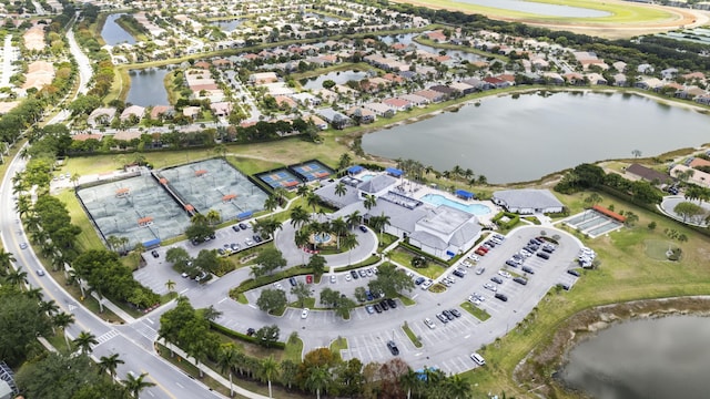 birds eye view of property with a residential view and a water view