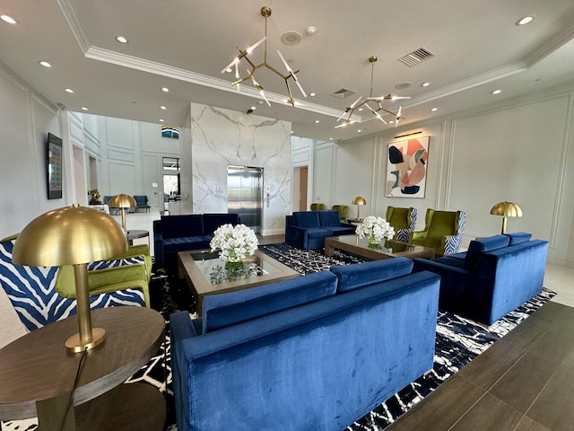 8926 Agliana Cir, Boynton Beach, FL 33472 - living room with an inviting chandelier, ornamental molding, a raised ceiling, and a decorative wall