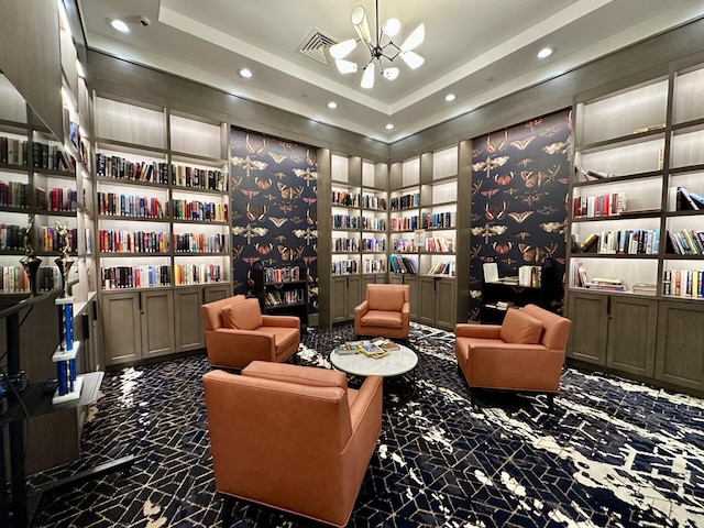8926 Agliana Cir, Boynton Beach, FL 33472 - living area with visible vents, recessed lighting, bookshelves, a chandelier, and built in shelves
