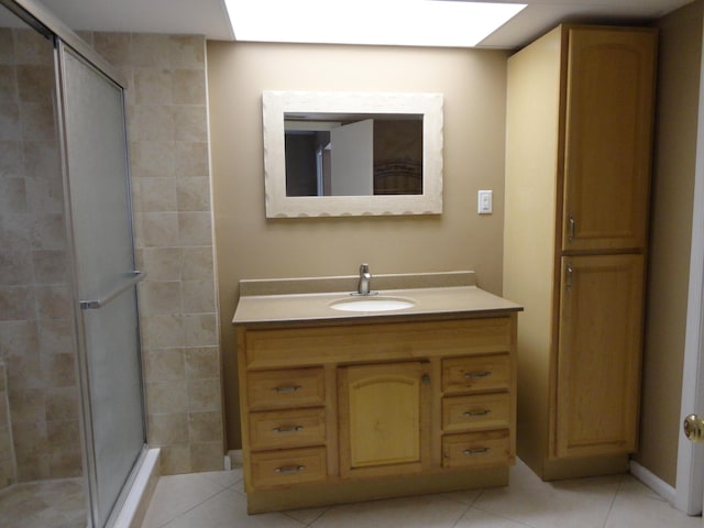 bathroom with vanity and a shower stall
