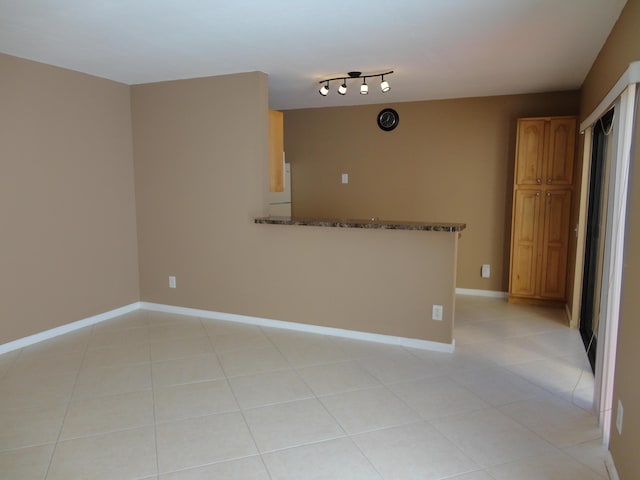 living area with light tile patterned floors and visible vents
