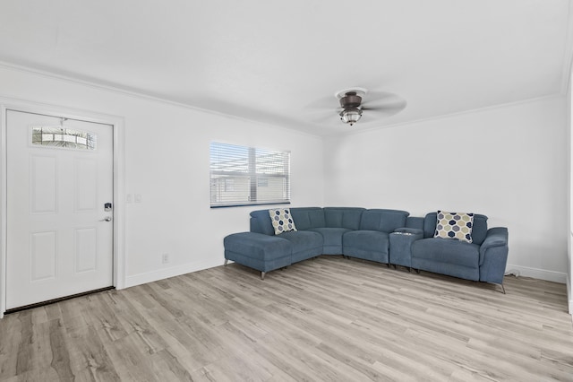574 Monaco L, Delray Beach, FL 33446 - living area featuring crown molding, ceiling fan, baseboards, and light wood-type flooring
