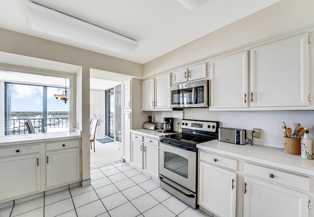 kitchen featuring light countertops, white cabinetry, and appliances with stainless steel finishes