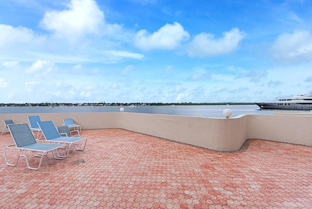 view of patio featuring a water view