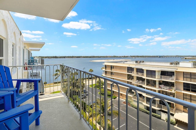 balcony featuring a water view
