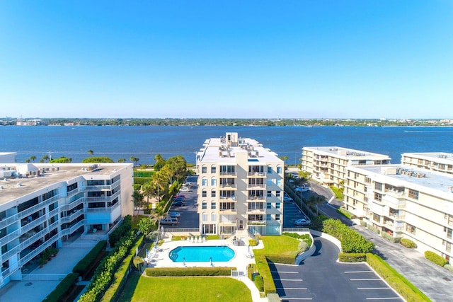birds eye view of property with a water view