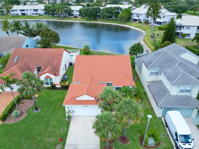 bird's eye view with a residential view and a water view