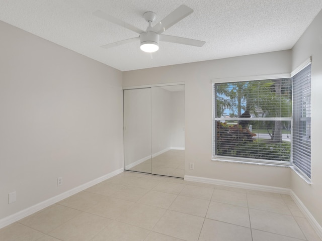 unfurnished bedroom featuring tile patterned floors and a textured ceiling