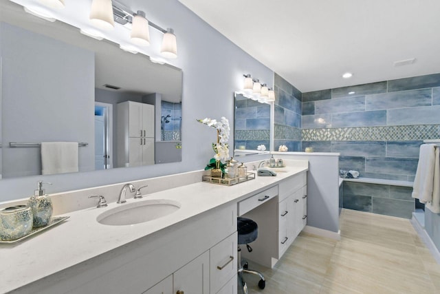 252 Legendary Cir, Palm Beach Gardens, FL 33418 - full bathroom featuring a sink, double vanity, tile walls, visible vents, and tile patterned flooring