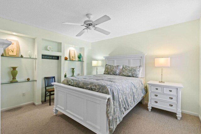252 Legendary Cir, Palm Beach Gardens, FL 33418 - bedroom featuring a ceiling fan, baseboards, a textured ceiling, and light colored carpet