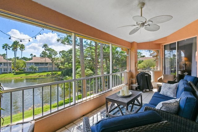 252 Legendary Cir, Palm Beach Gardens, FL 33418 - sunroom with outdoor lounge area, a ceiling fan, and a water view