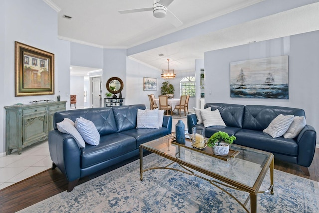 252 Legendary Cir, Palm Beach Gardens, FL 33418 - living area with baseboards, crown molding, light wood-type flooring, and ceiling fan with notable chandelier