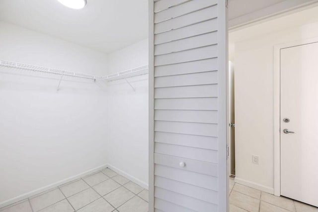 walk in closet featuring light tile patterned floors
