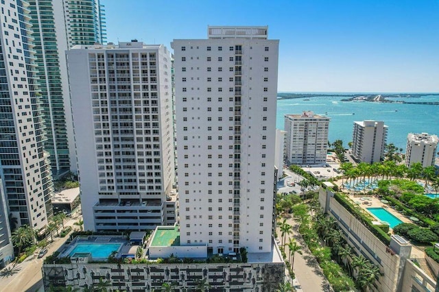 aerial view featuring a city view and a water view