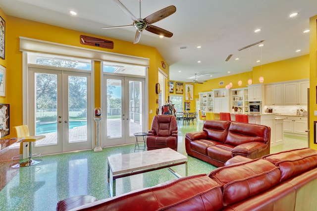 living area with a ceiling fan, french doors, and recessed lighting