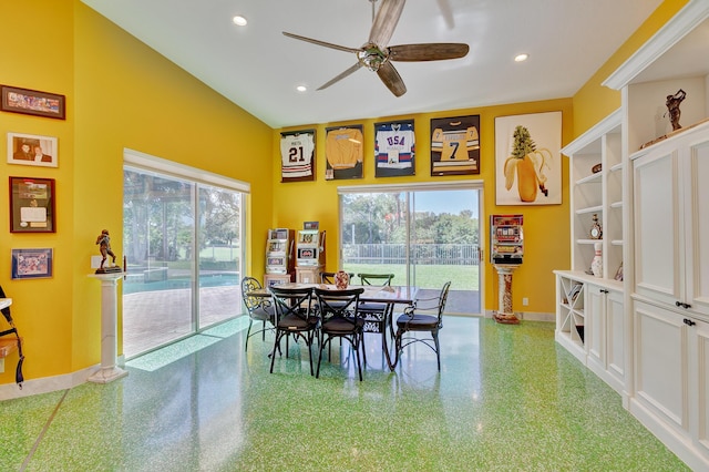 dining room with a towering ceiling, baseboards, recessed lighting, and ceiling fan