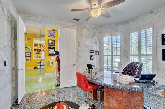 office with visible vents, speckled floor, and ceiling fan