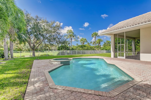 view of swimming pool featuring a patio area, a yard, and a fenced backyard