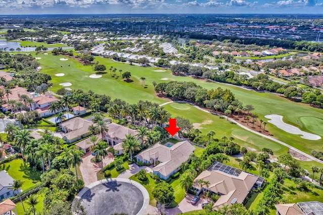 drone / aerial view with a residential view and golf course view