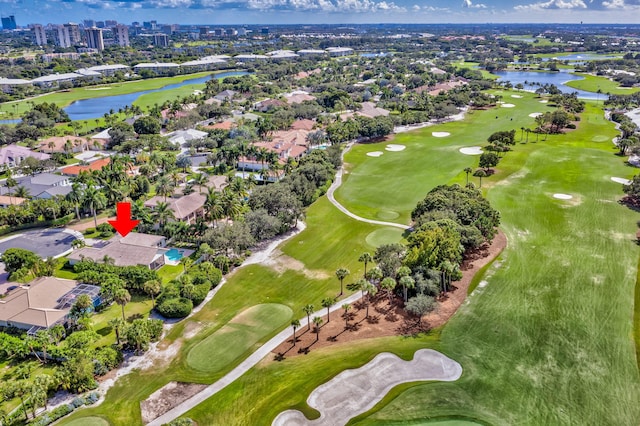 birds eye view of property with golf course view, a residential view, and a water view