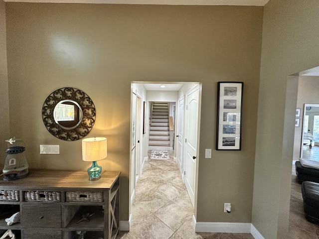 corridor featuring baseboards