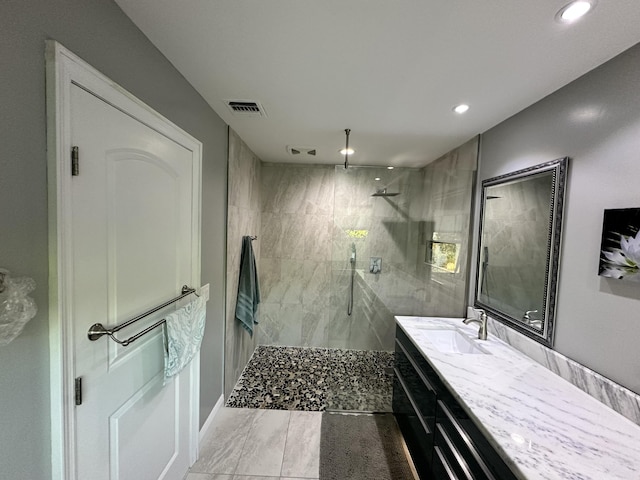 bathroom featuring visible vents, vanity, marble finish floor, recessed lighting, and a walk in shower
