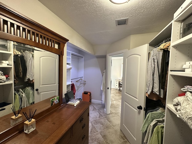 spacious closet with visible vents