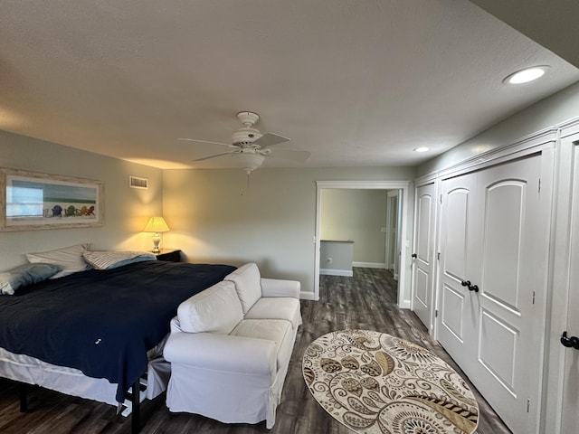 bedroom featuring visible vents, wood finished floors, baseboards, a closet, and recessed lighting