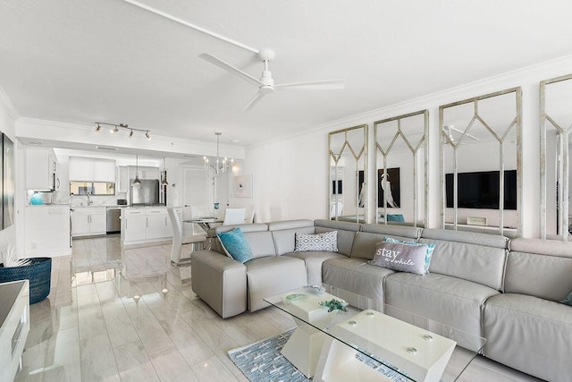 living room with crown molding and ceiling fan with notable chandelier