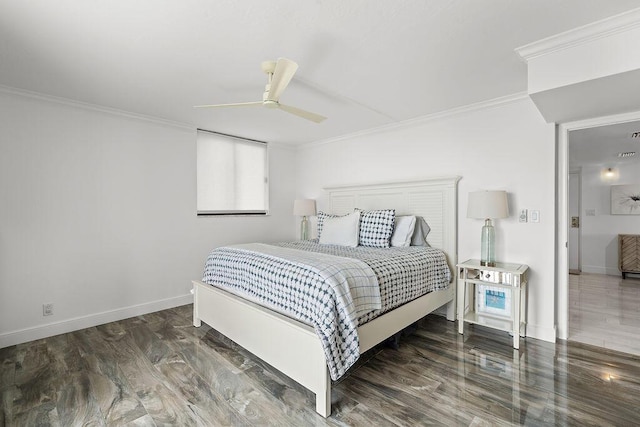 bedroom featuring a ceiling fan, baseboards, crown molding, and wood finished floors