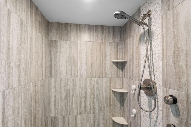 details featuring a tile shower