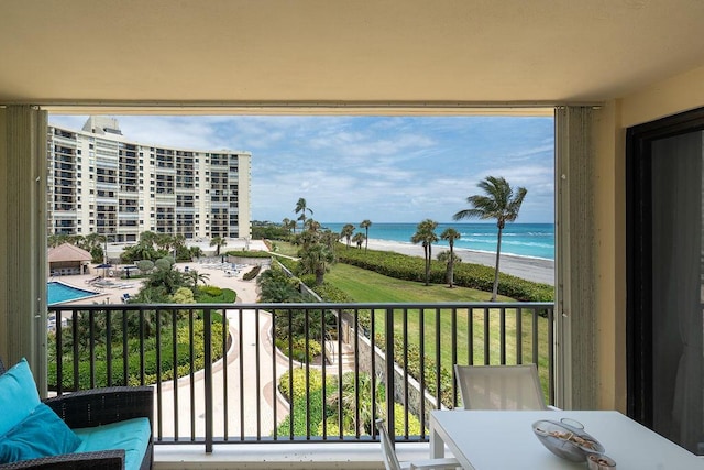 balcony with a view of the beach and a water view