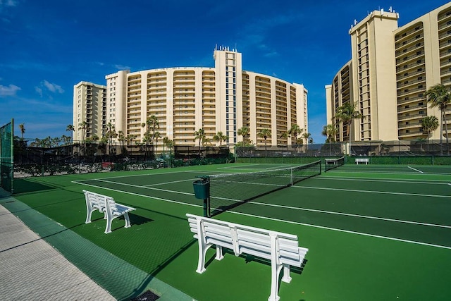 view of tennis court featuring fence