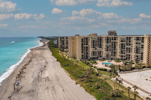 aerial view featuring a view of the beach and a water view