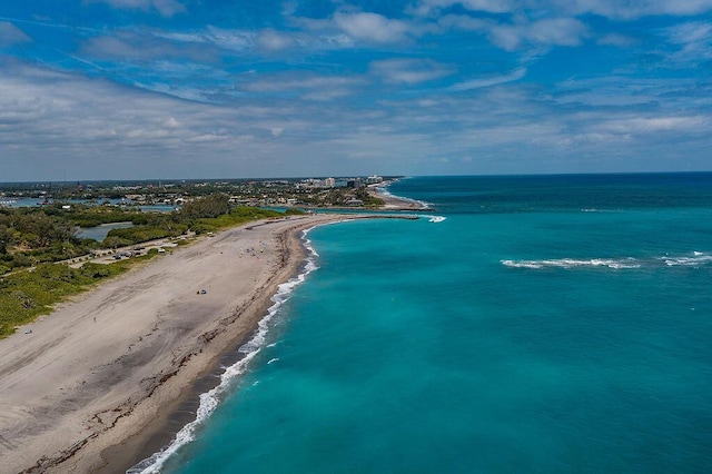 bird's eye view featuring a beach view and a water view