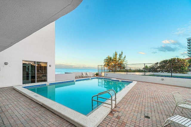 3407 S Ocean Blvd Unit 7A, Highland Beach, FL 33487 - community pool featuring fence, a patio area, and a water view