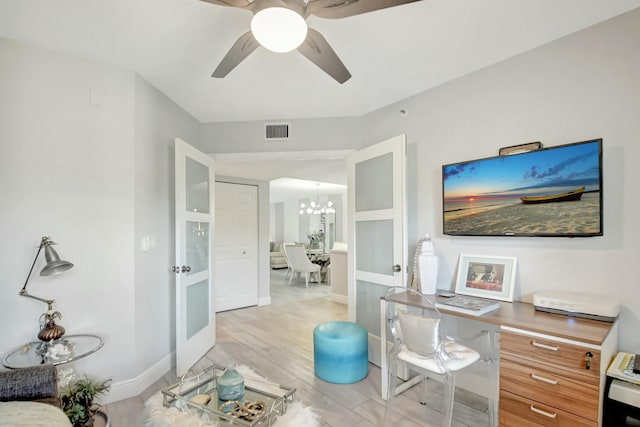 5749 Gemstone Ct Unit 404, Boynton Beach, FL 33437 - office area with baseboards, light wood-style floors, visible vents, and ceiling fan with notable chandelier