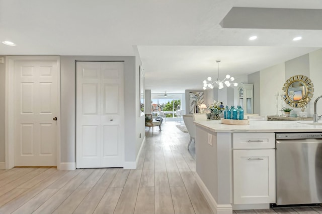 5749 Gemstone Ct Unit 404, Boynton Beach, FL 33437 - kitchen featuring dishwasher, white cabinetry, a notable chandelier, and light wood finished floors