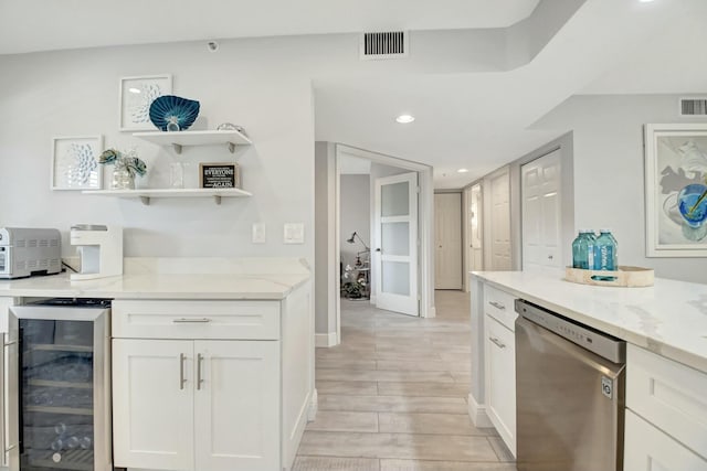 5749 Gemstone Ct Unit 404, Boynton Beach, FL 33437 - kitchen featuring light stone countertops, stainless steel dishwasher, visible vents, and beverage cooler